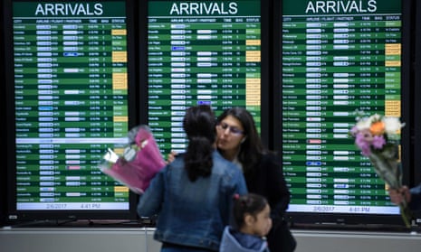 People arrive at Washington Dulles International Airport on 6 February.