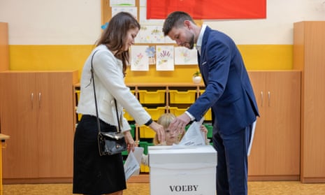 Michal Šimečka, lead candidate of Progressive Slovakia (PS) political party, casts his ballot with his family.