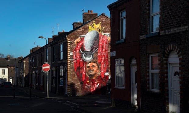 A mural near Anfield of Jordan Henderson lifting the Premier League trophy.
