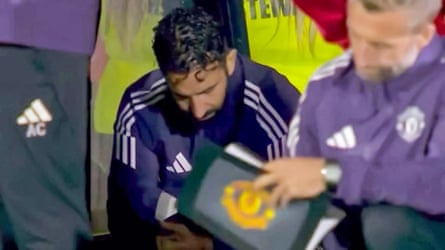 Ruben Amorim sits in the dugout during United’s shootout defeat against Grimsby.