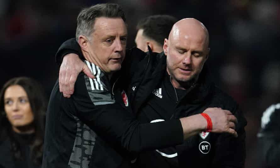 Tony Roberts embraces the Wales manager, Rob Page, after the team beat Austria to reach a World Cup play-off final against Scotland or Ukraine.