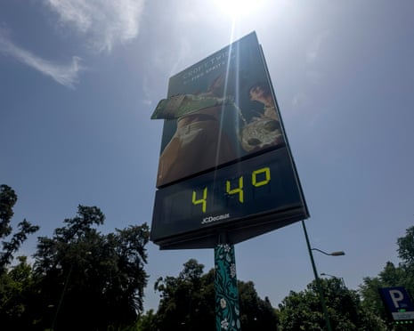 A street thermometer reads 44 degrees Celsius during a heatwave in Sevilla, Spain.