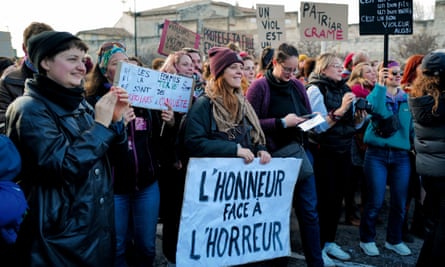 A woman holds a placard that reads “honour in the face of horror” a rally in support of Gisèle Pelicot near the Avignon courthouse