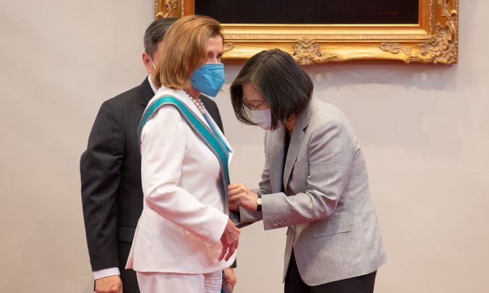 Pelosi receives the Order of Propitious Clouds with Special Grand Cordon Tsai on Wednesday.