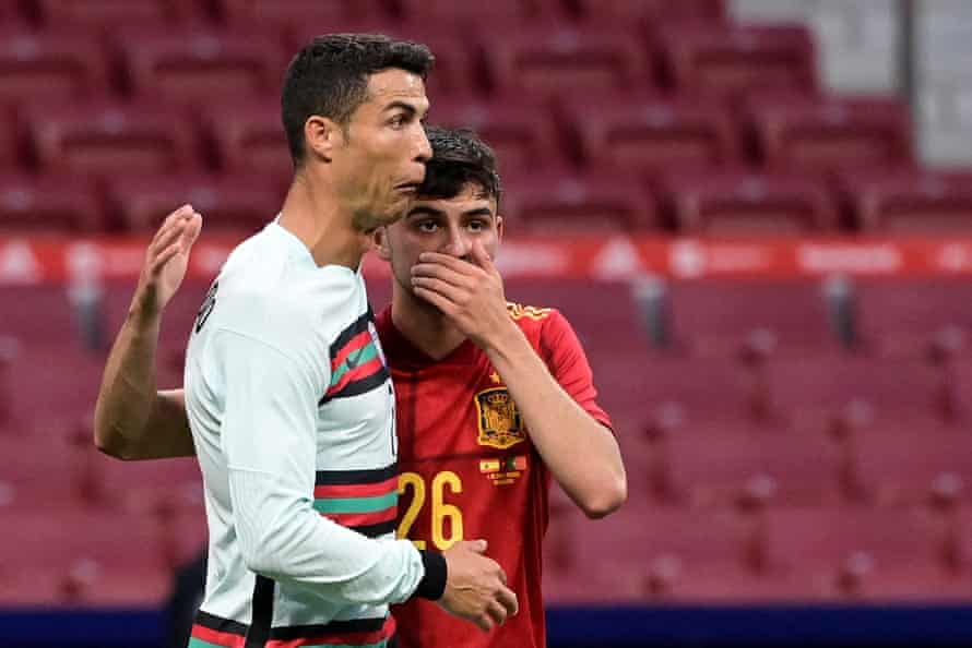 Pedri with Cristiano Ronaldo during their friendly.