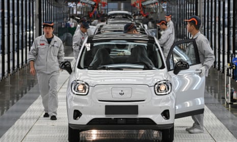 Staff work on the assembly line of the Leapmotor T03 electric small crossover at its factory Jinhua, China