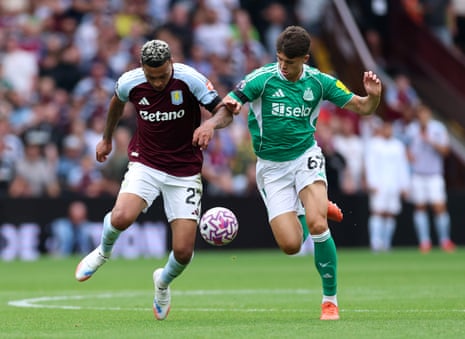 Morgan Rogers battles for possession with Lewis Miley.