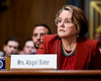 a woman speaks into a microphone