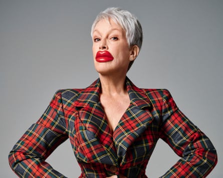 Jamie Lee Curtis wearing a tartan jacket and comically oversized red wax lips
