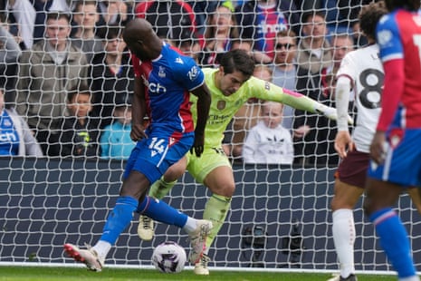 Manchester City's goalkeeper Stefan Ortega (centre) beats Crystal Palace's Jean-Philippe Mateta with a nifty drag back.