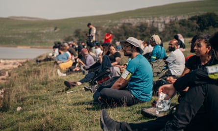 Members of Muslim Hikers take a rest near Malham Cove, North Yorkshire.
