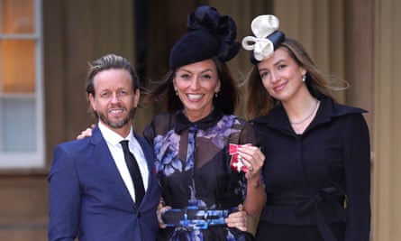 ‘Because we were hairdresser and client, we’d already gone deep’: with partner Michael Douglas and daughter Holly Robertson after being made an MBE on 31 January 2024.