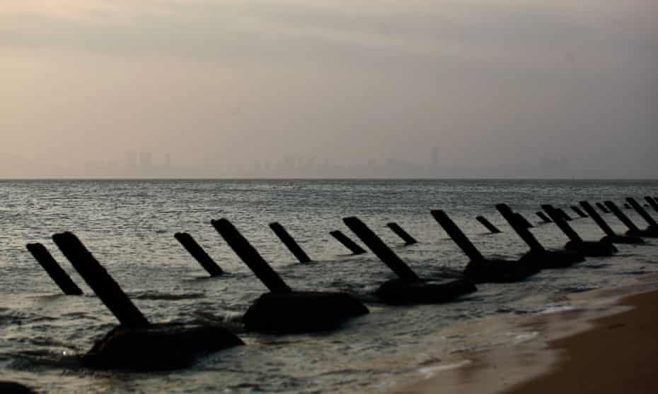 Anti-tank spikes line a beach at Cihu on the main island in Kinmen, a Taiwanese territory, with the Chinese city of Xiamen in the distance