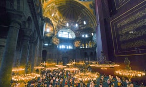 Muslims, wearing protective masks as a precaution against infection from coronavirus gather for the Eid al-Adha prayer inside the Byzantine-era Hagia Sophia, recently converted back to a mosque, in the historic Sultanahmet district of Istanbul, Friday, July 31, 2020.