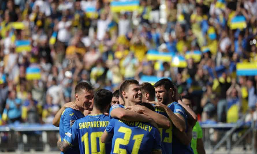 Ukraine’s Ruslan Malinovskyi celebrates scoring their first goal with teammates.