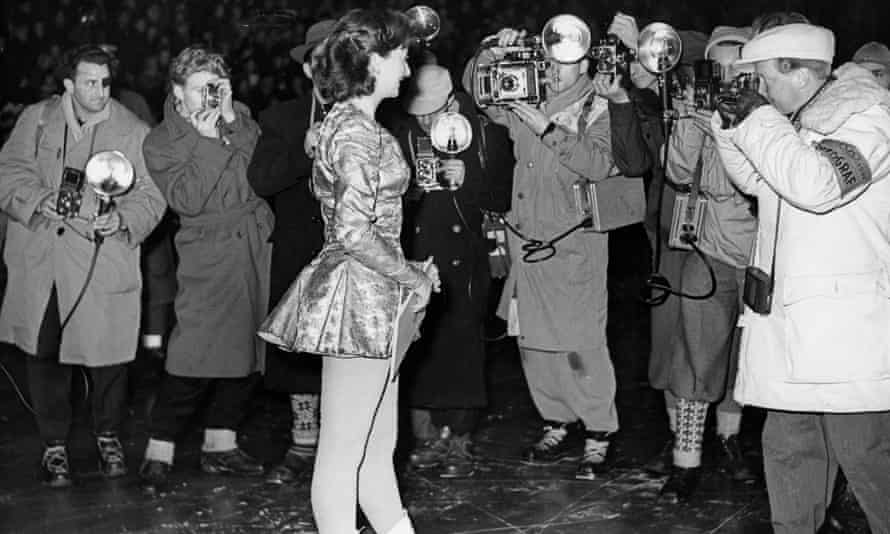 Jeannette Altwegg surrounded by photographers in 1952, after winning gold at the Olympic Games in Oslo, Norway.