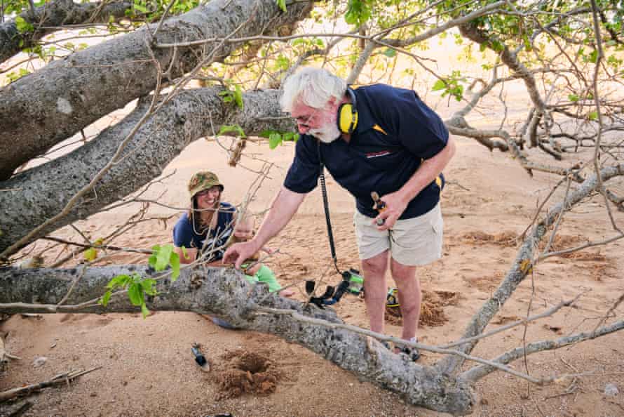 Local historian Mike Owen, with the help of local fossicker Jess McLean digs up a rifle shell casing from the second world war near the site where Dion McLean found what could be a 500-year-old Iranian coin at Buffalo Creek, Northern Territory.