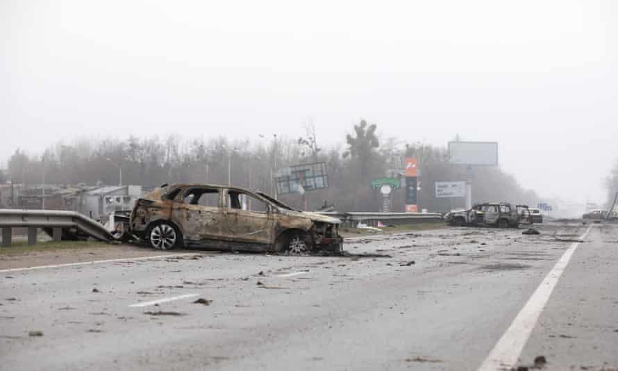 Destroyed cars seen on a highway 20km from Kyiv near the town of Bucha.