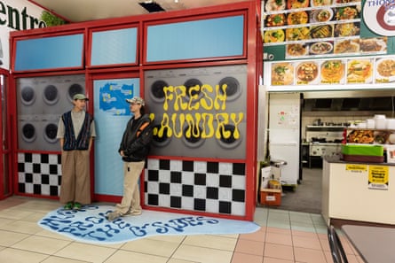 Two business partners outside their laundromat in Auckland