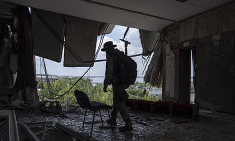 A Ukrainian serviceman in Mykolaiv’s regional military administration building, which was hit by a Russian missile in March