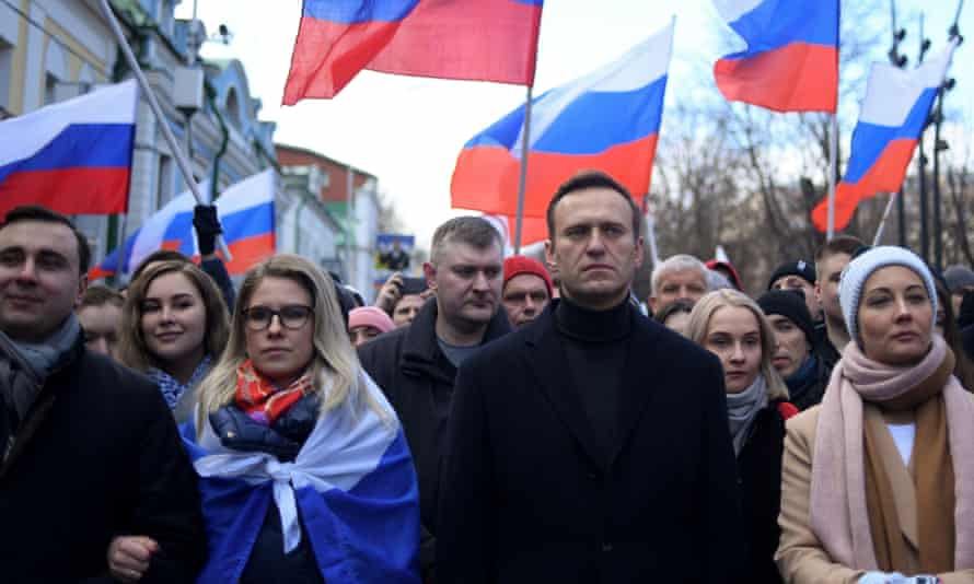 Russian opposition leader Alexei Navalny and Lyubov Sobol (left) at a protest in February.