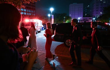 Attendees leave the Washington Hilton after being evacuated from the White House Correspondents’ Dinner in Washington, D.C.