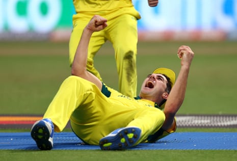 Pat Cummins celebrates after taking the catch to dismiss South Africa's Quinton de Kock.