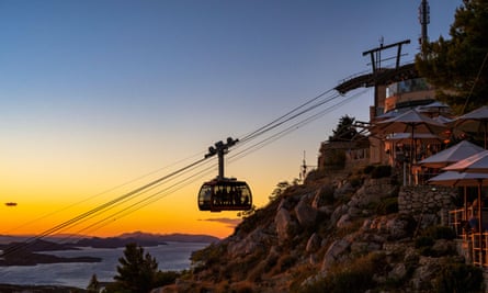 The cable car ascending at sunset.