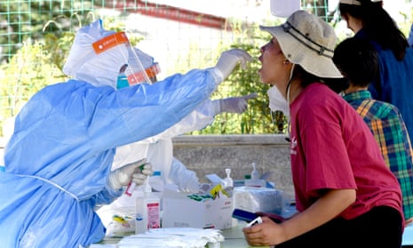 A medical worker takes a Covid swab sample in Lhasa, Tibet