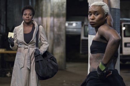 Viola Davis wearing a mac and and Cynthia Erivo standing next to a punchbag