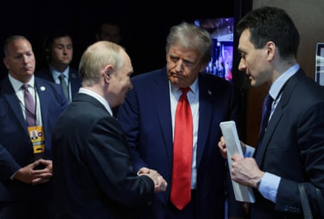 Men in suits shake hands