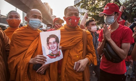 Thai monks hold a portrait of Aung San Suu Kyi during a demonstration against Myanmar’s military coup in Bangkok