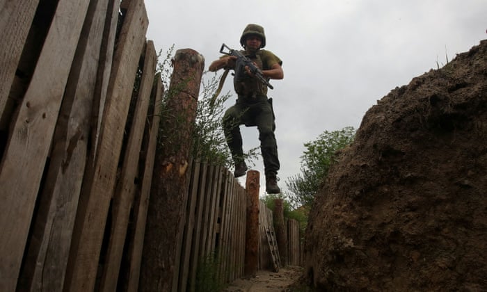 FILE PHOTO: Russia’s attack on Ukraine continues, in Kharkiv regionFILE PHOTO: A member of the Ukrainian National Guard jumps into a trench at a position near a front line, as Russia’s attack on Ukraine continues, in Kharkiv region, Ukraine August 3, 2022. REUTERS/Vyacheslav Madiyevskyy/File Photo