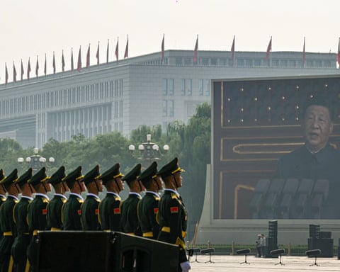 Chinese president Xi Jinping on a large screen as he delivers a speech at the start of the military parade in Beijing’s Tiananmen Square on Wednesday