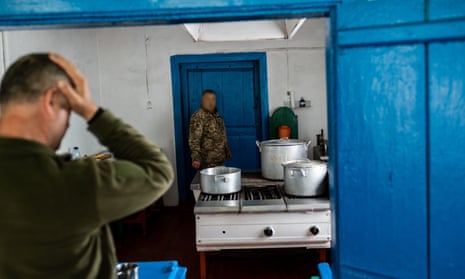 Ukrainian soldiers in the kitchen of a local school. Critics said the report ignored Ukraine’s wartime realities.