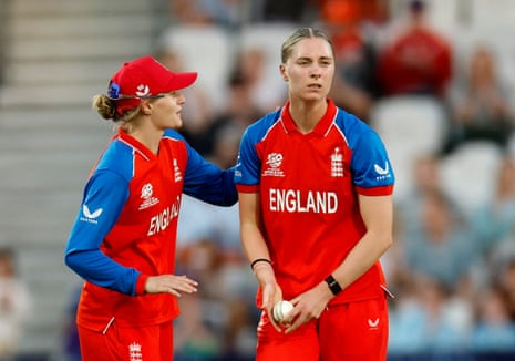 Freya Kemp celebrates with Charlie Dean after taking the wicket of Scotland's Priyanaz Chatterji