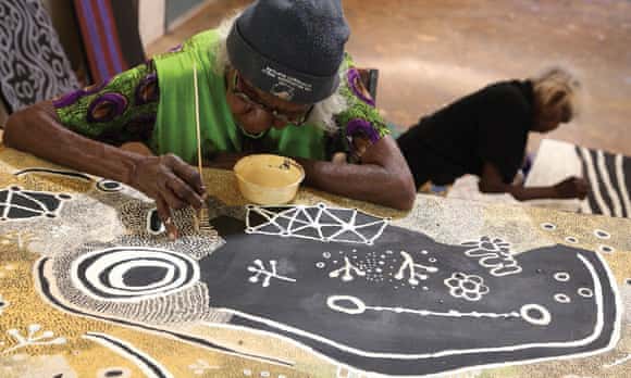 Martha McDonald Napaltjarri (in foreground) and Mona Nangala painting at Papunya Tjupi art centre, Papunya, 2015. Papunya is a remote settlement of the Northern Territory from which the Papunya art style, commonly known as dot painting, began.