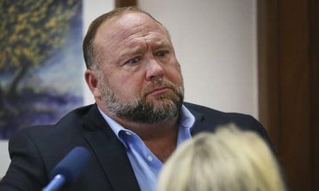 Conspiracy theorist Alex Jones attempts to answer questions about his emails during his trial in Austin, Texas.