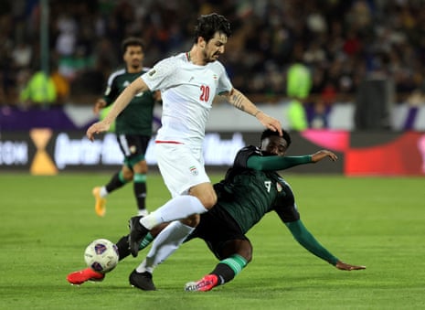 Iran's Sardar Azmoun in action with United Arab Emirates' Kouame Kouadio.