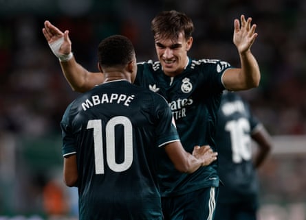 Carlos Espí and Kylian Mbappé celebrate during La Liga match between Elche and Real Madrid
