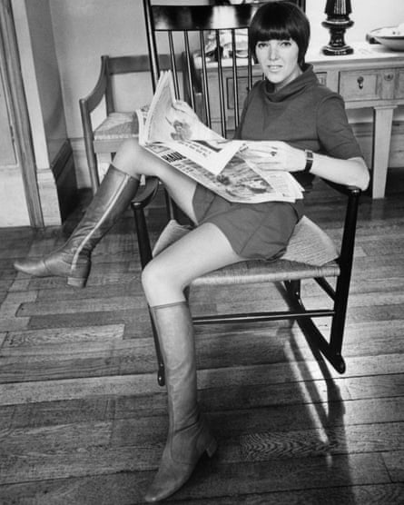 Quant wearing a miniskirt and flat boots in 1967.