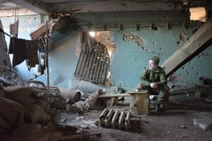 A serviceman smokes a cigarette during a break at the Butivka mine near Donetsk, Ukraine