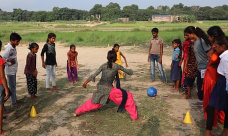 Young girls learn to play football in Nepal