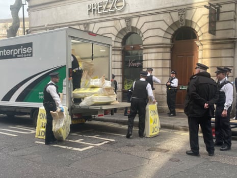 Police confiscating signs from a peaceful anti-monarchy demonstration