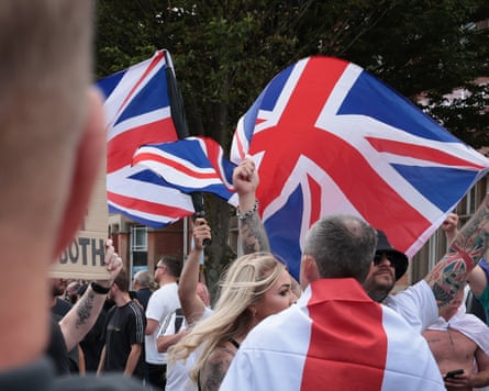 Protesters waving union flag