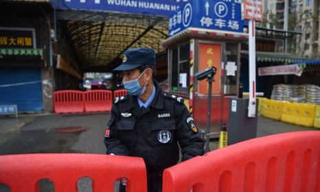 Officer guarding Huanan market