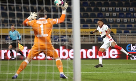 Arminia Bielefeld's saves a shot in a match at home against RB Leipzig