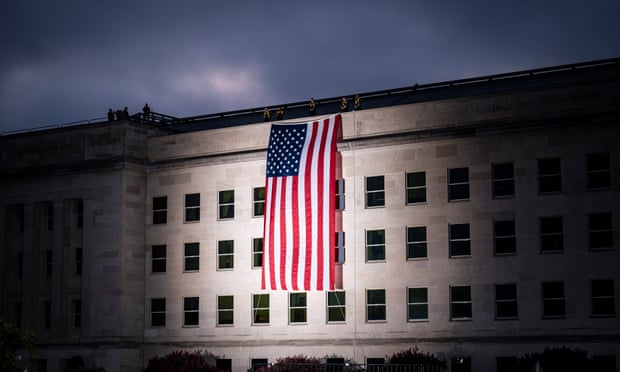 The US national flag is draped over the Pentagon building ahead of a 9/11 anniversary. Democrats have criticised Trump’s firing defence staff during a presidential transition.