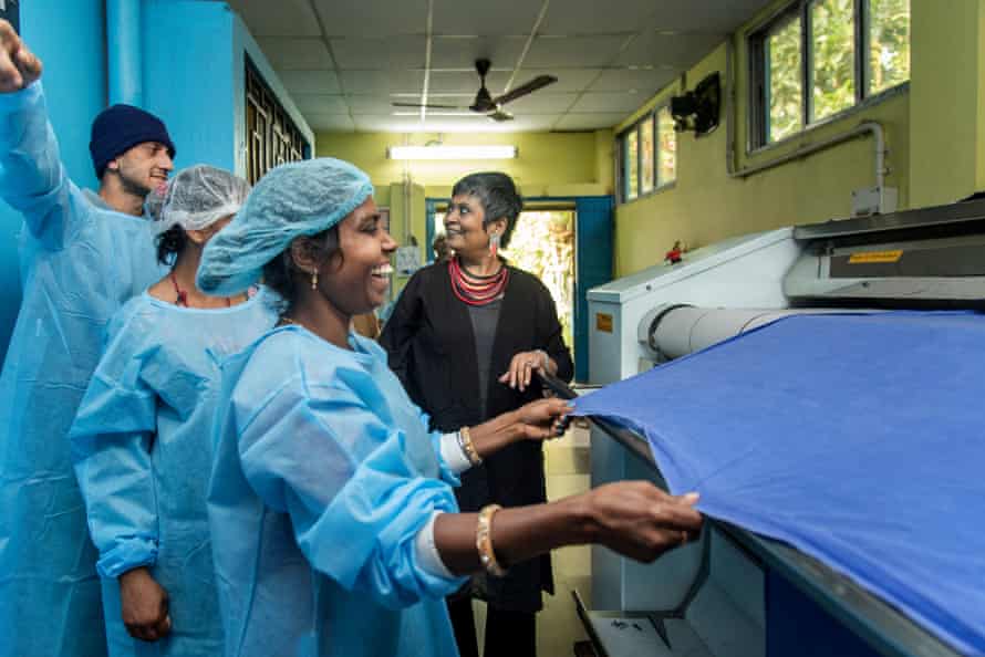 Ratnaboli Ray with the team at the launderette her foundation set up in Kolkata Pavlov hospital, which patients are paid to run.