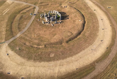 Stonehenge in Wiltshire is one of many green, grassy landscapes dried out by the extreme hot weather this summer.